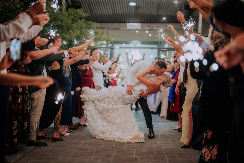 Bride & groom kissing during their sparkler exit at Enzo Hunter Valley